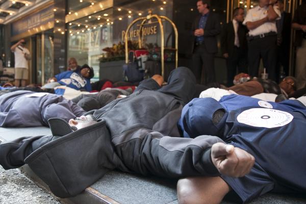 Protestors staged a die-in outside of the Palmer House Hilton where ALEC held is annual meeting (Source: Progress Illinois)