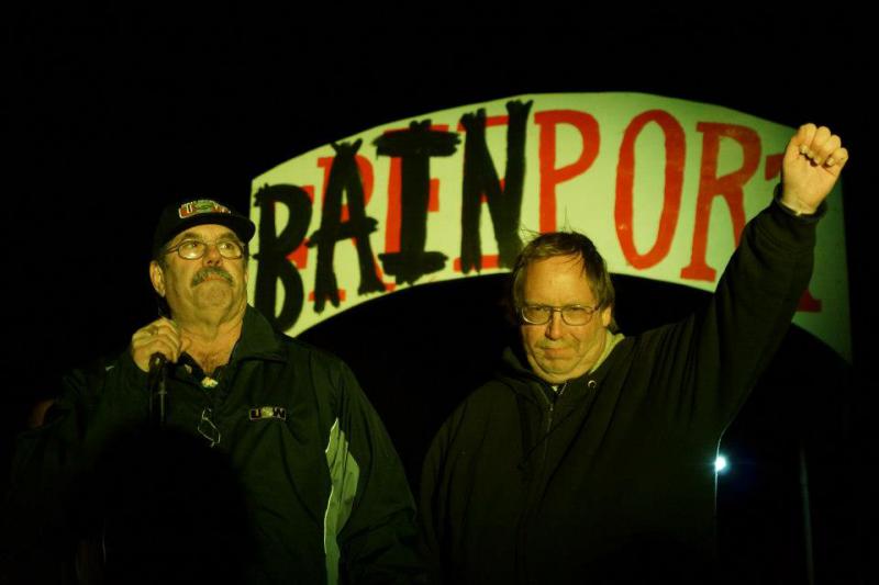 USW President Leo Gerard and Sensata worker Tom Gaulrapp on stage in front of Bainport sign