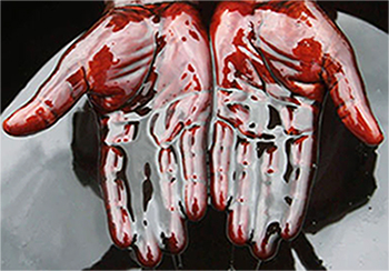 hands covered in crude oil