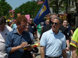 Former U.S. Senator Russ Feingold leads the march down State St