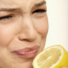Image of woman with sour face from lemon