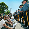 Image of Students and police outside Sallie Mae's shareholder meeting. (source: AFT)