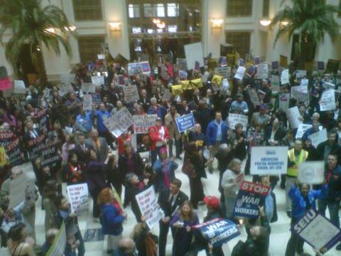 Hundreds of protesters pack The Homer Building in Washington, DC