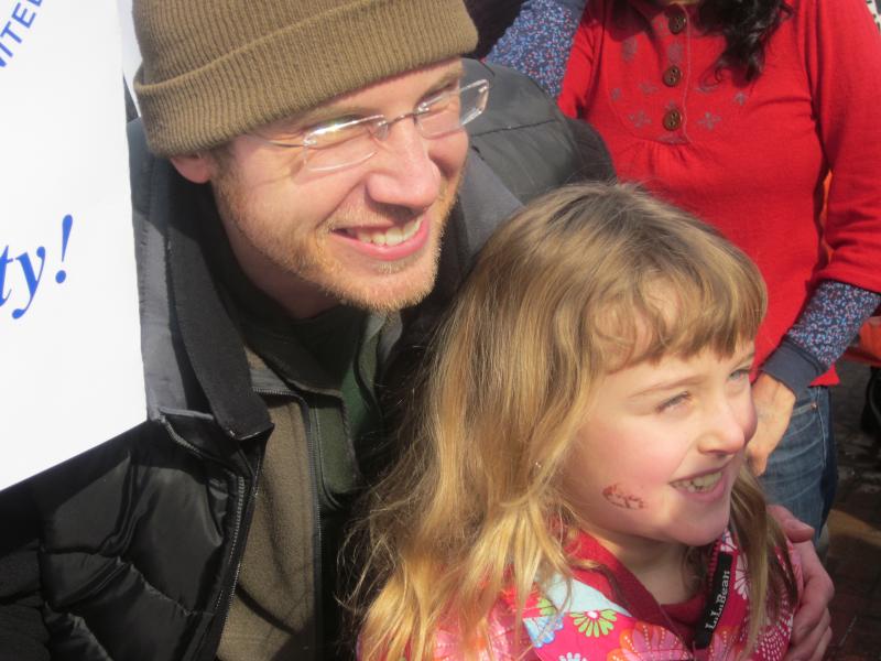 A young girl is enthusiastic at the rally