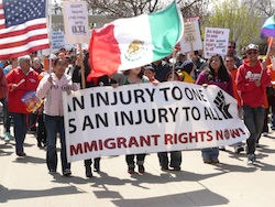 Immigrant Rights Now protest banner
