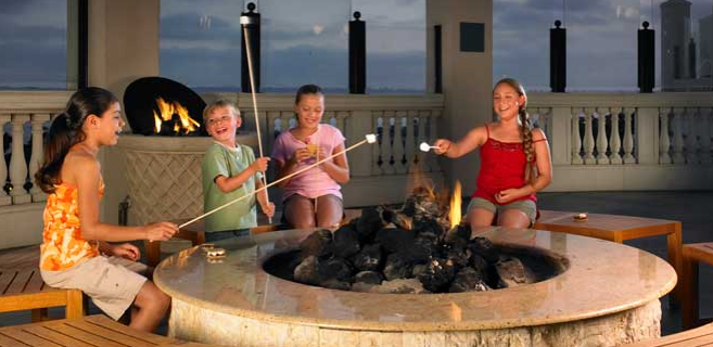 Kids roasting marshmallows at the Manchester Grand Hyatt, San Diego