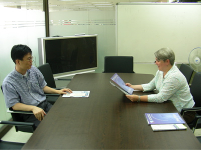 Mr. Jean Min provided me with copies of the agenda materials from OMN's last two International Citizen Reporters' Forums (Photo: Jean-Marc Poisson)