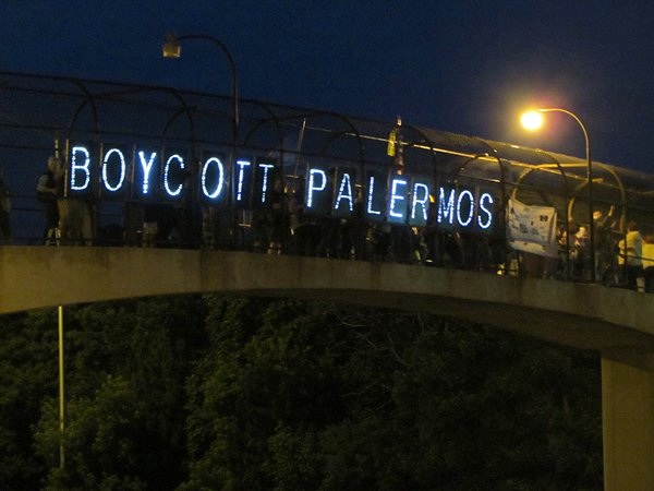 image of LED signs that say "boycott palermos"