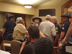 Protesters escorted out of the building