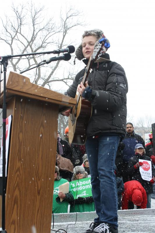 Sam Frederick playing a song at the rally today.