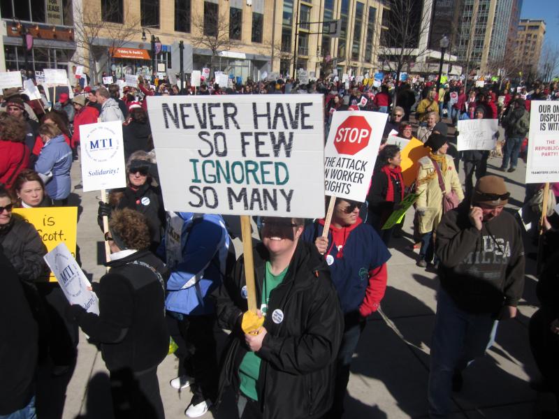 Never Have So Few Ignored So Many protest sign