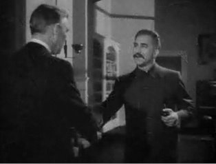 An actor playing Joseph Stalin greets the U.S. ambassador in a scene from "Mission to Moscow" (Warner Brothers, 1943). (Source: Wikipedia)