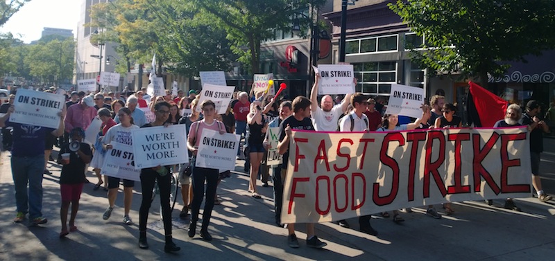 Striking workers and their allies march up State Street in Madison, WI (photo by Alex Oberley)