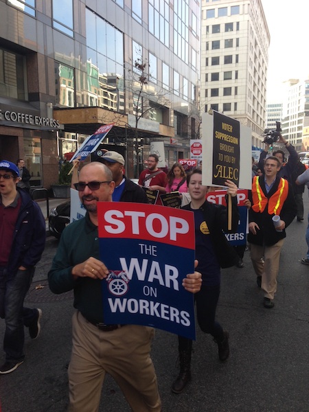 Activists protest the American Legislative Exchange Council (ALEC) in Washington, DC, 12-5-2013