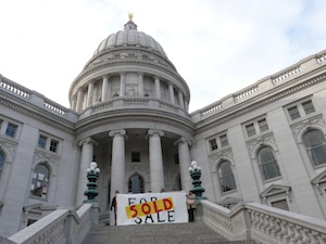 Wisconsin State Capitol with SOLD sign in front